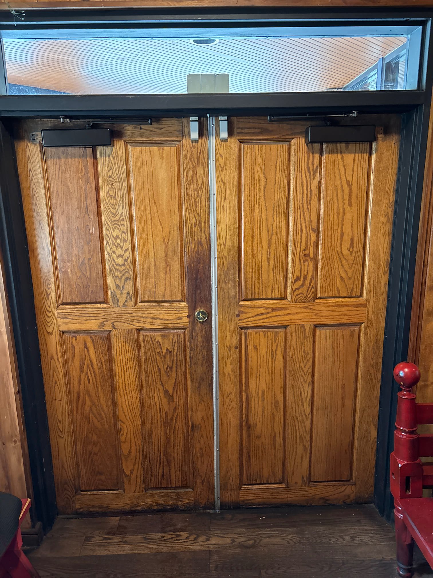 Entrance door repair — surface closer replacement on heavy wooden front door 07 16A